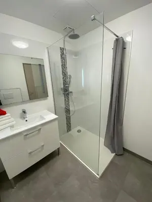 a bathroom with a glass shower and a sink at Villa A CASA DI FICU à 14kms d'Ajaccio et des plages avec Piscine Jacuzzi Pétanque Sans vis à vis in Peri