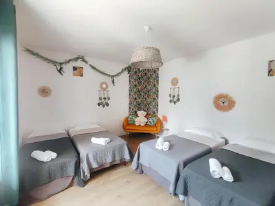 a room with two beds and a window at Villa A CASA DI FICU à 14kms d'Ajaccio et des plages avec Piscine Jacuzzi Pétanque Sans vis à vis in Peri