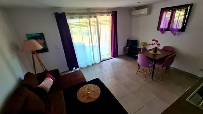 a living room with a couch and a table at Appartement Caroline in Sotta