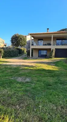 a house with a large lawn in front of it at Appartement Caroline in Sotta