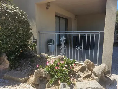 a house with a gate with faces painted on it at Appartement Caroline in Sotta
