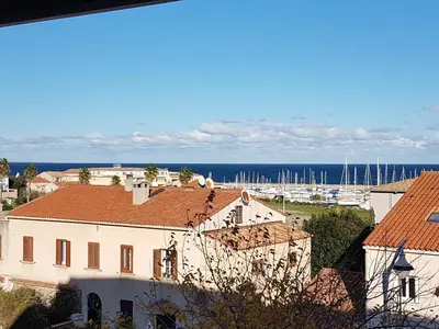 a view of a town with boats in a harbor at DOLCE VITA in Kamiesch