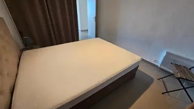 a small room with a bed in a room at DOLCE VITA in Kamiesch