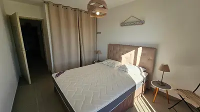 a bedroom with a large bed in a room at DOLCE VITA in Kamiesch