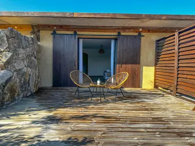 a table and two chairs sitting on a patio at Résidence de la Plage in Porto-Vecchio