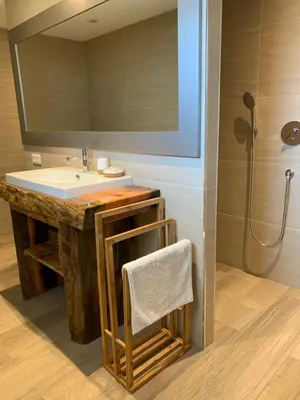 a bathroom with a sink and a mirror at Résidence de la Plage in Porto-Vecchio
