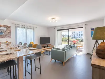 a dining room with a long table and chairs at Apartment Domaine d'Arca-3 by Interhome in Porto-Vecchio