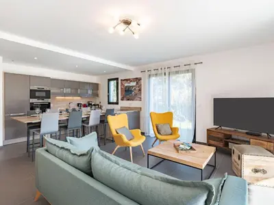 a living room with a blue couch and yellow chairs at Apartment Domaine d'Arca-3 by Interhome in Porto-Vecchio