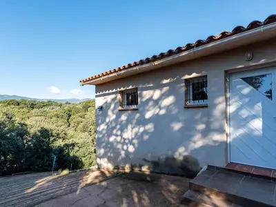 a white house with the sun shining on it at Holiday Home Villa Boccajo by Interhome in Porto-Vecchio