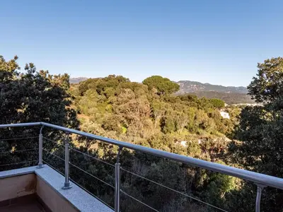 a balcony with a view of the forest at Holiday Home Villa Boccajo by Interhome in Porto-Vecchio