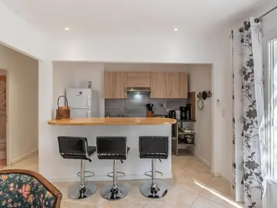 a living room with a couch and a table at Apartment Cappone by Interhome in Sari Solenzara