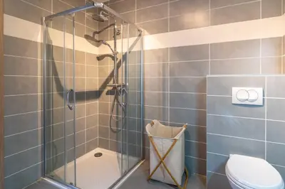 a shower stall in a bathroom with a toilet at Fronte di Mare - deux pièces en bord de mer in Propriano
