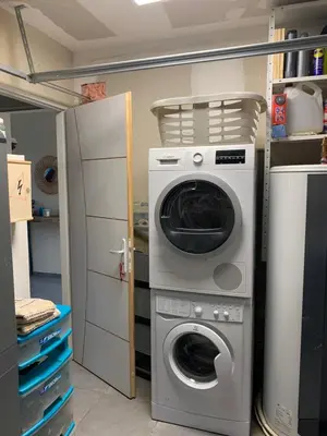 a washing machine and a washer in a kitchen at Jolie maison Borgo trois chambres trois salles de bain in Borgo