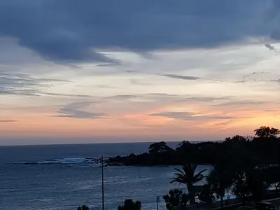 a view of the ocean at sunset at JACUZZI AJACCIO ENTRE MER ET MONTAGNE 200m DES PLUS BELLES PLAGES in Ajaccio
