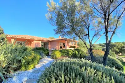 a garden in front of a house at Villa La Tour de Pinarello in Mangialla
