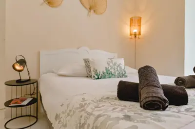 a bedroom with a bed with a towel on it at Studio rénové Hyper Centre- Ajaccio in Ajaccio