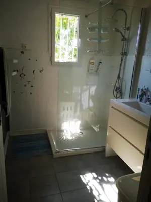 a bathroom with a shower and a sink at Maison de village avec jardin privatif in Zicavo