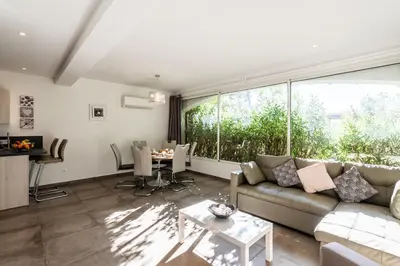 a living room with a couch and a table at Les Arcades de Cala Rossa in Lecci