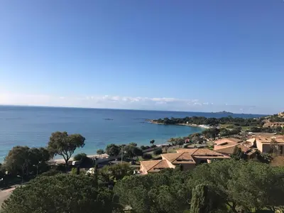 a view of a town and the ocean at Superbe appartement T2 Vue magnifique Sanguinaires à 50m de la plage in Ajaccio