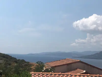 a view of a body of water with a building at Casa Lova in Propriano