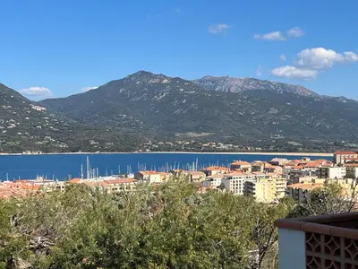 a view of a city and a body of water at Casa Lova in Propriano