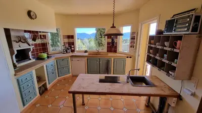 a kitchen with a counter and a sink in it at CASA SOPRANA - HAUT DE VILLA indépendant avec piscine et jardin privés - Independant TOP OF VILLA with private pool and garden in Porto-Vecchio