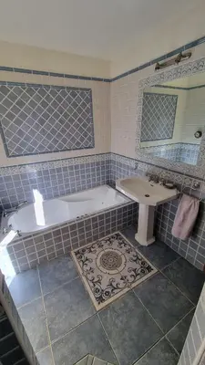 a bathroom with a tub and a sink at CASA SOPRANA - HAUT DE VILLA indépendant avec piscine et jardin privés - Independant TOP OF VILLA with private pool and garden in Porto-Vecchio