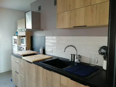 a kitchen with a sink and a counter top at Centre ville avec vue magnifique sur le golfe d'Ajaccio; parking privé. in Ajaccio