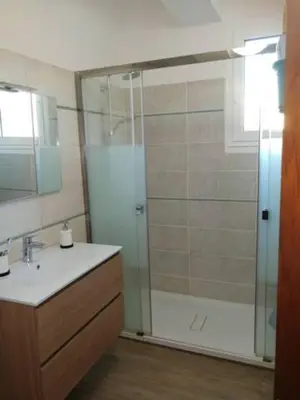 a bathroom with a shower and a sink at Centre ville avec vue magnifique sur le golfe d'Ajaccio; parking privé. in Ajaccio