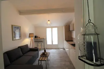 a living room with a couch and a table at Rogliano in Porto-Vecchio