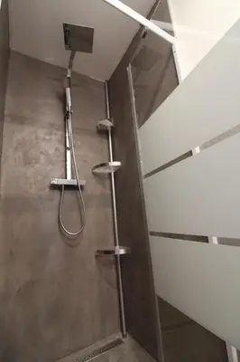 a shower in a bathroom with a glass door at Rogliano in Porto-Vecchio