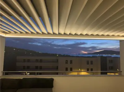 a window with a view of a building at Appartement T3 de standing, vue mer - Porticcio in Grosseto-Prugna