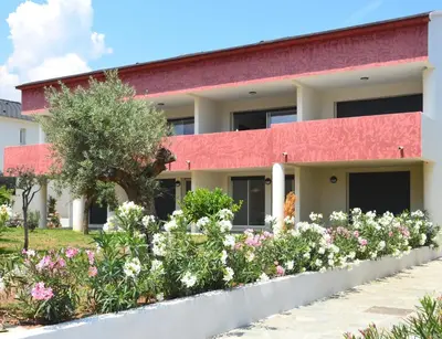 a lobby with a stone bar with couches and chairs at Apartment next to the sea 4 peoples-WIFI-TV-Air Conditioning-Moriani Haute-Corse in San-Nicolao