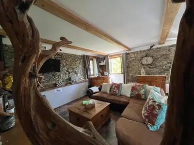 a living room with a couch and a table at A CASA CANTUNNIERA in Pietroso