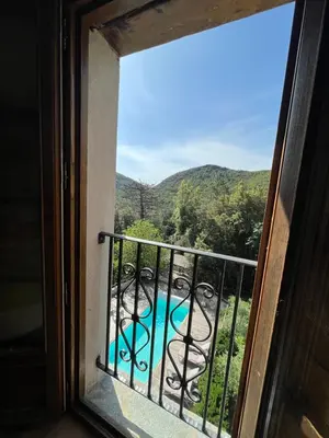 a view from a window of a pool at A CASA CANTUNNIERA in Pietroso
