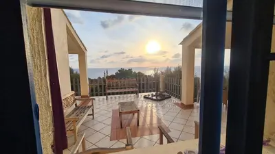 a view of a balcony with a view of the ocean at Belvedere de Canaloro in Sari Solenzara