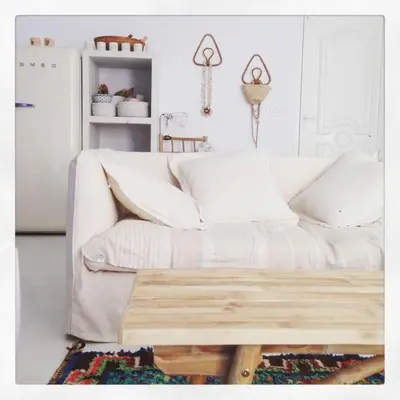a living room with a white couch and a table at Villa de standing, piscine chauffée,Balagne, Pietralba in Pietralba