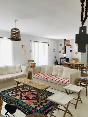 a living room with white couches and a table at Villa de standing, piscine chauffée,Balagne, Pietralba in Pietralba