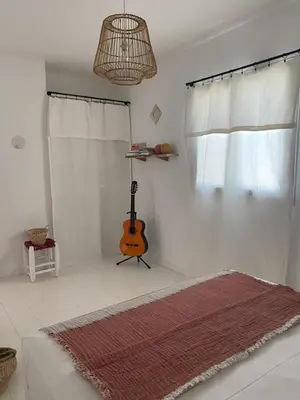 a room with a guitar in the corner of a room at Villa de standing, piscine chauffée,Balagne, Pietralba in Pietralba