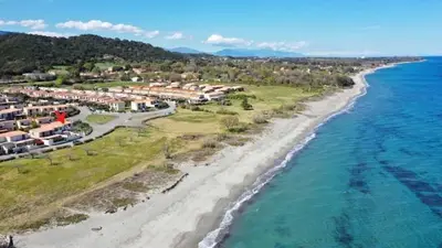 an aerial view of the beach and the ocean at Mini villa chaleureuse avec vue mer imprenable in San-Nicolao
