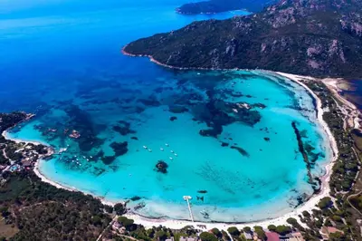an aerial view of the blue lagoon at Mini Villa At 150m From The Beach Of Santa Giulia in Porto-Vecchio