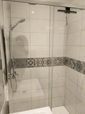 a shower with a glass door in a bathroom at Cosystudio centre Ajaccio in Ajaccio