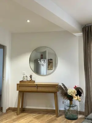 a dressing table in a room with a mirror at Charmant T2 refait à neuf in Ajaccio