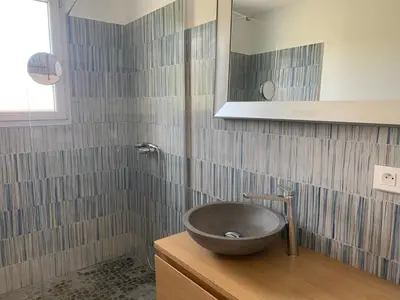 a bathroom with a bowl sink and a shower at Casa Rosalinda in Figari