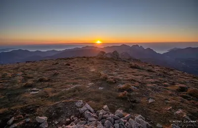a sunset on the top of a mountain at Strada di a cuma in Vico