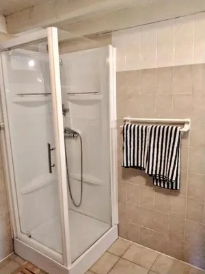 a shower with a glass door in a bathroom at Strada di a cuma in Vico