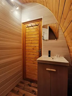 a bathroom with a sink and a mirror at Ma cabane au fond du jardin in Porto-Vecchio