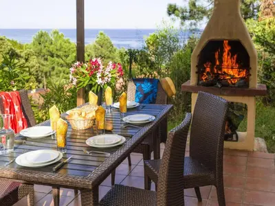a pool with chairs and people in the water at Res Mare e Monte, Solenzara, Bungalow with terrace in Favone
