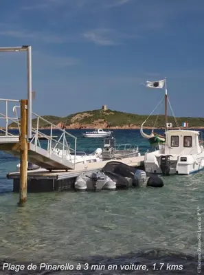 a group of boats docked at a dock in the water at Villa Renajolo 6 pers 3 min plage en voiture in Sainte-Lucie de Porto-Vecchio