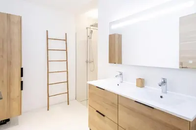 a bathroom with a sink and a mirror at Villa Renajolo 6 pers 3 min plage en voiture in Sainte-Lucie de Porto-Vecchio